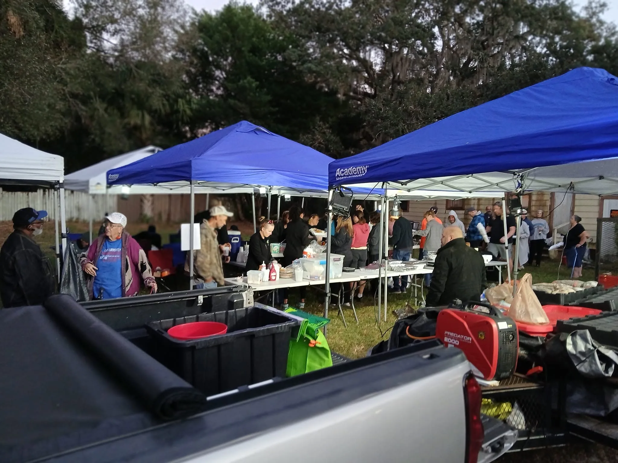 Volunteers and neighbors outdoors at a WOTS gathering